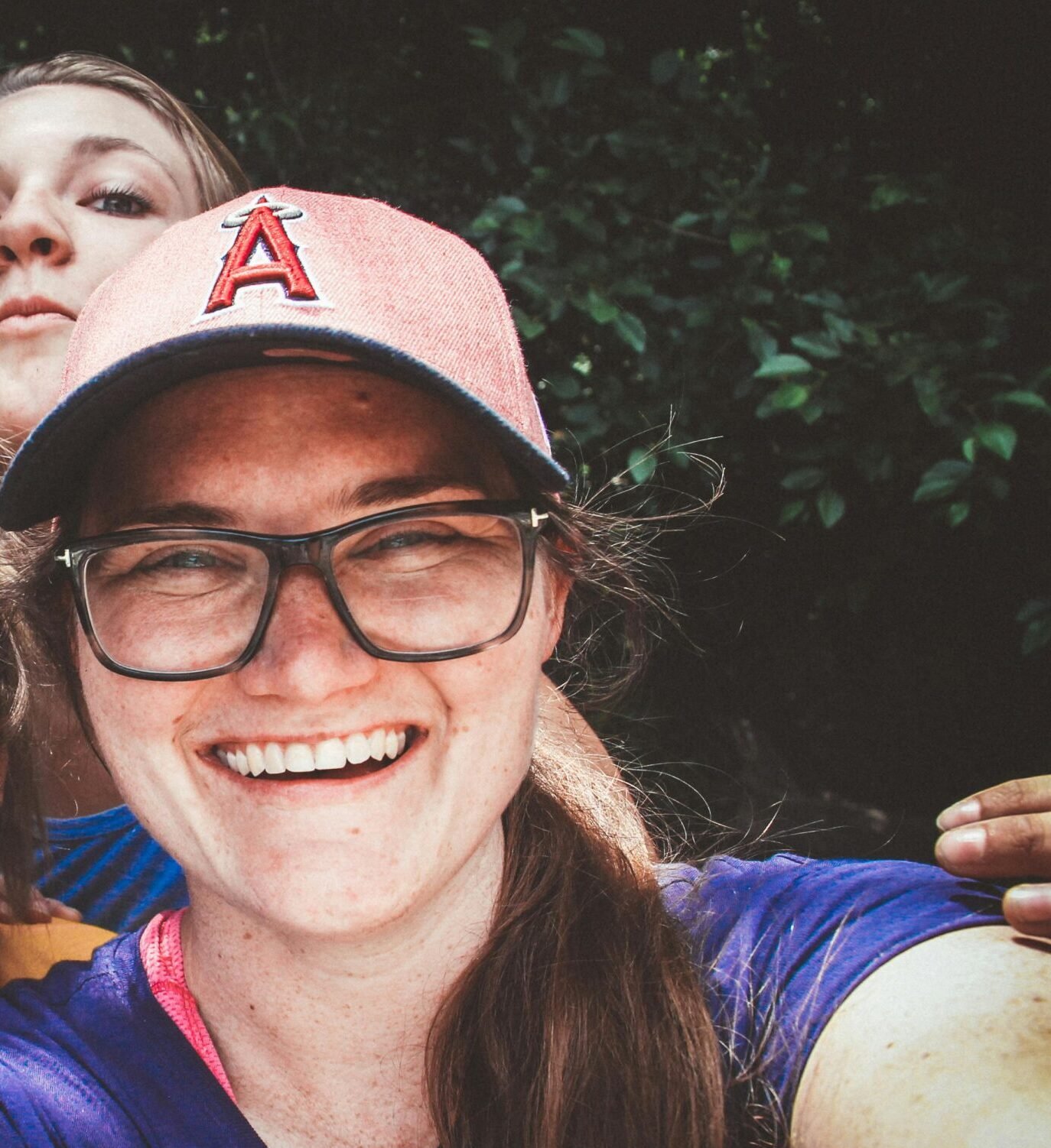 A joyful group of women taking a selfie outdoors, showcasing happiness and friendship.